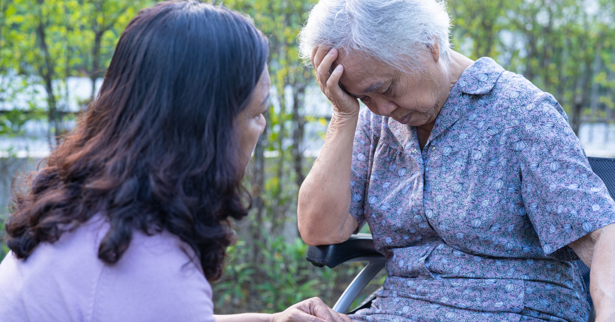 woman with old mother on wheelchair