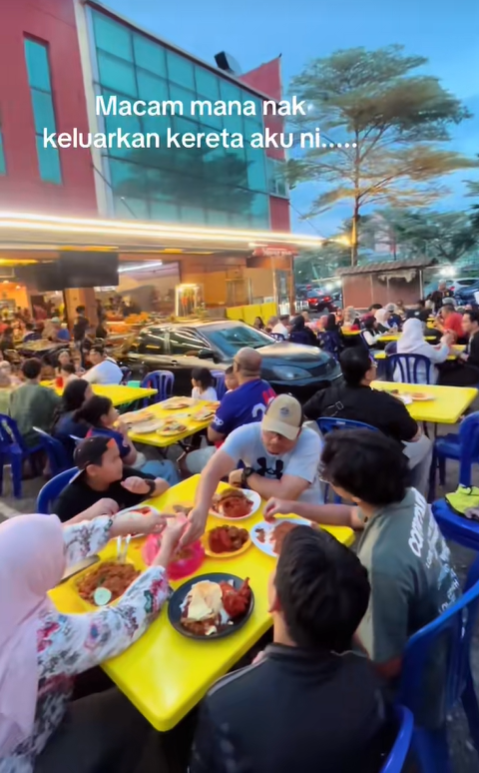 Woman's car blocked by tables and chairs