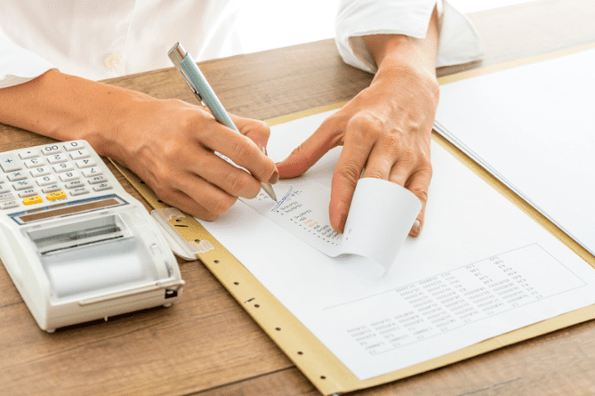 Man issuing a paper receipt