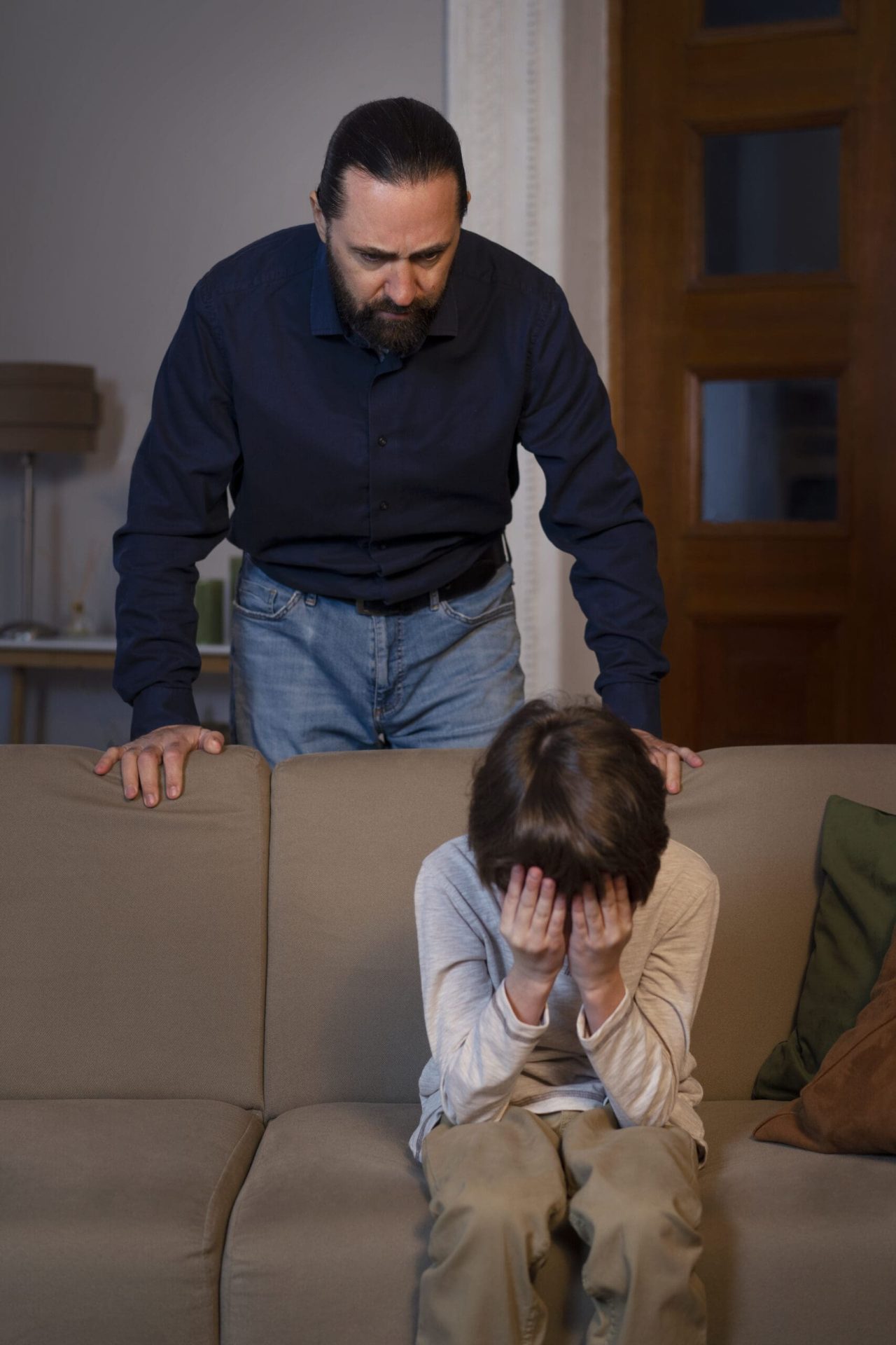 A father scolding his son