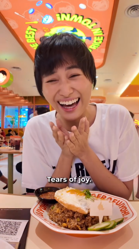 YouTuber smiles after getting fried rice