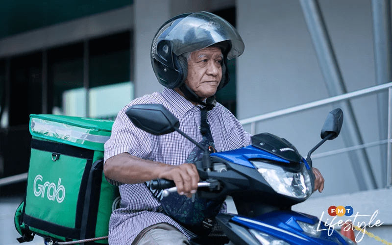 70yo Grab rider Zakaria Abdul Wahab on the job