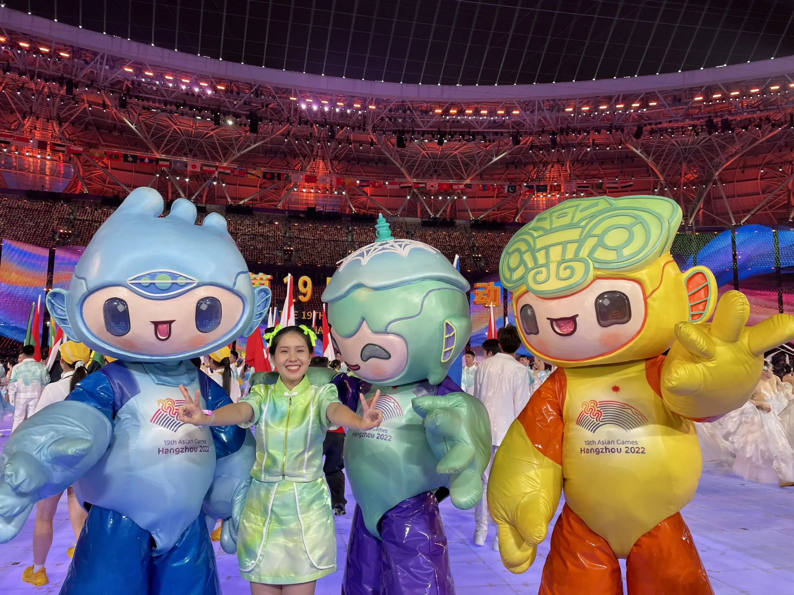 Zi Hui, a Malaysian performing at the Hangzhou Asian Games with the mascots