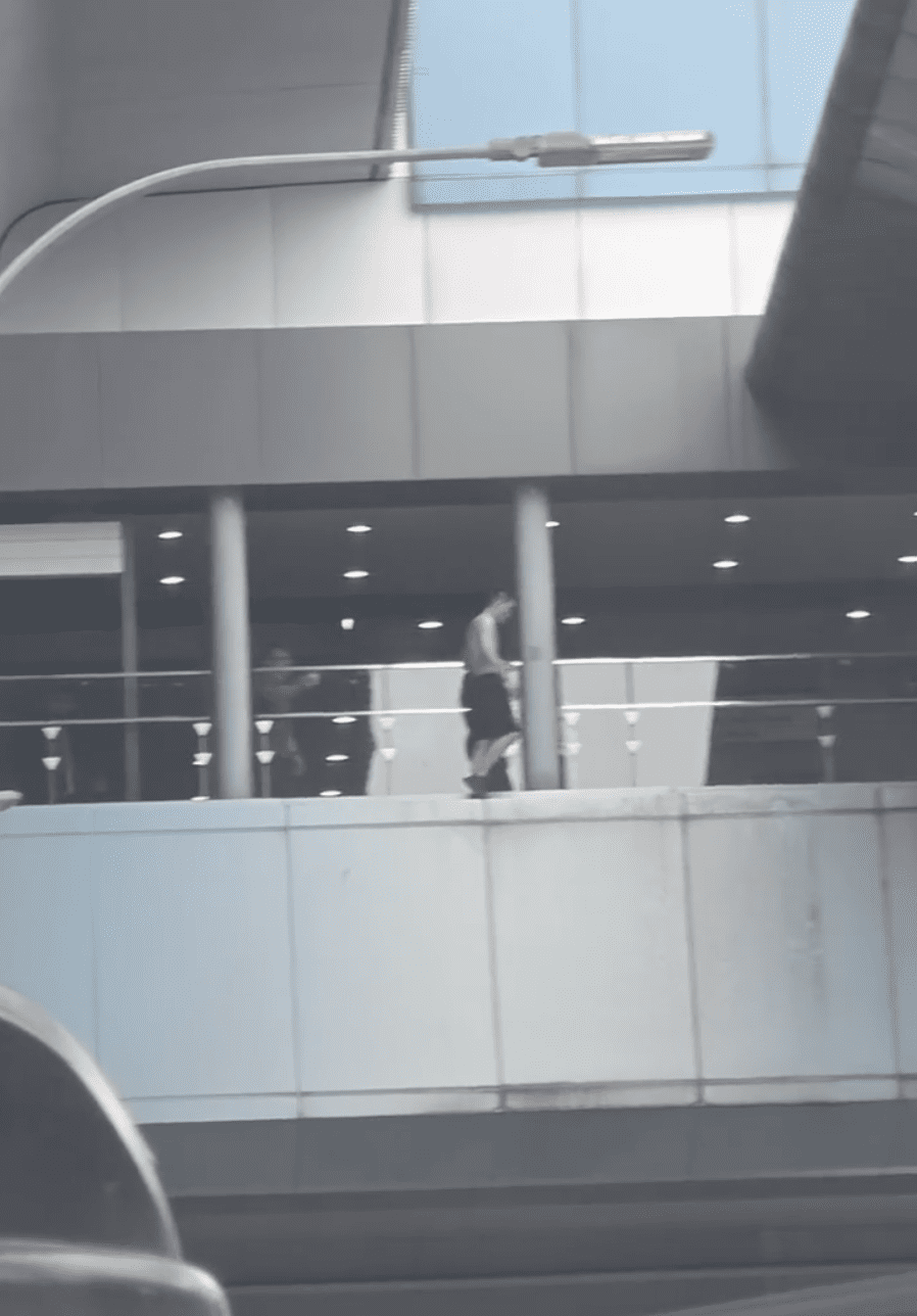 Taiwanese man seen walking on the ledge at midah mrt station