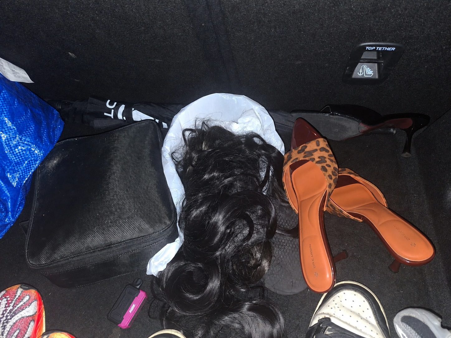  wk wig n heels inside car boot 