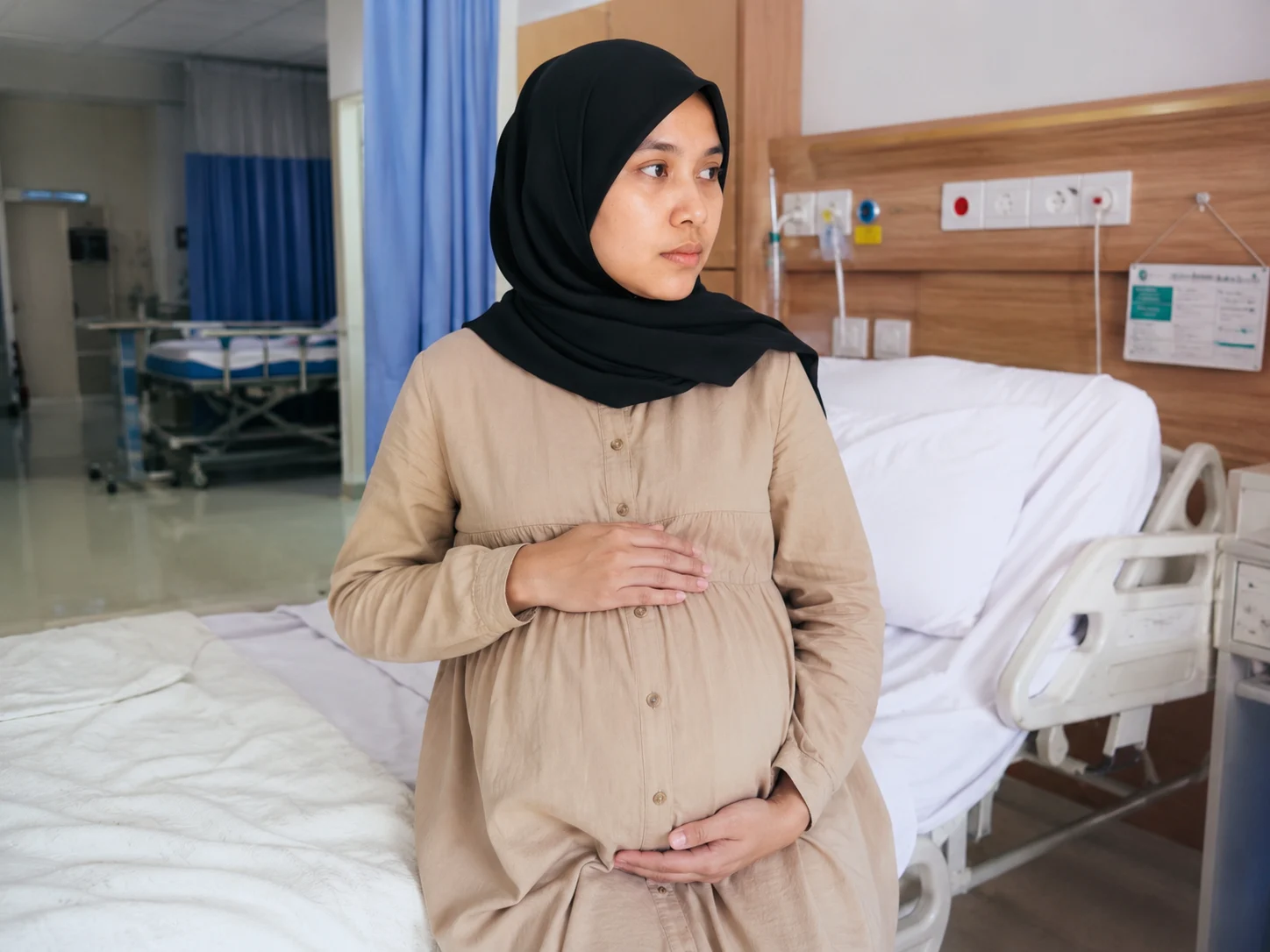 wk maternity room with contemplative mother