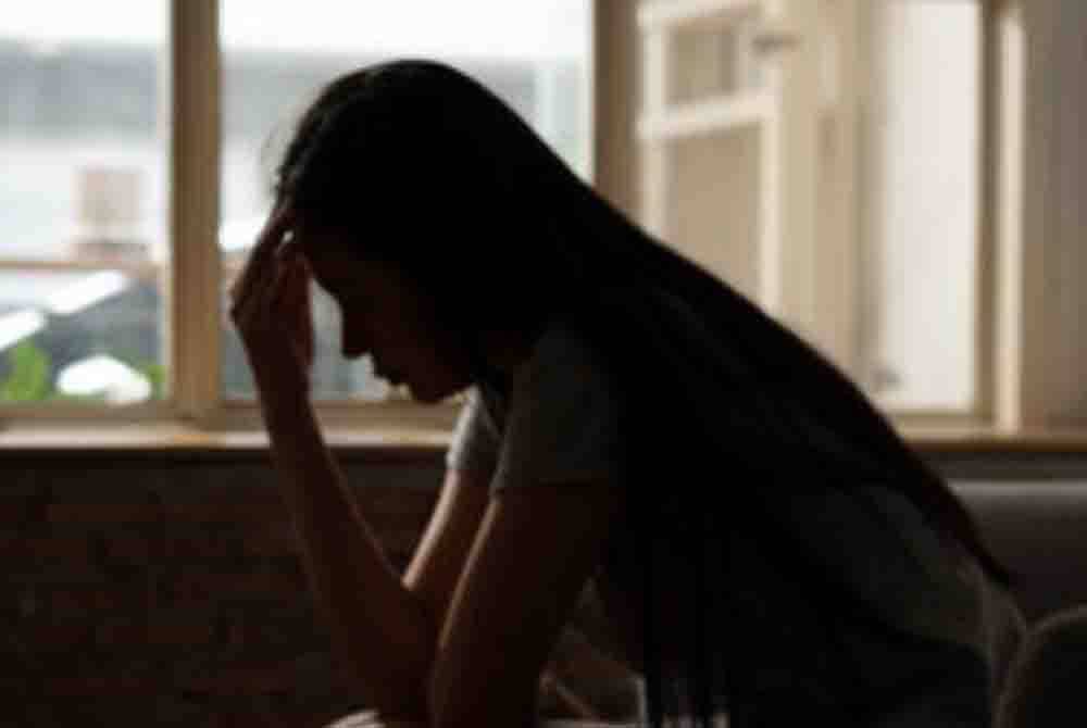 woman seemingly frustrated by the window 