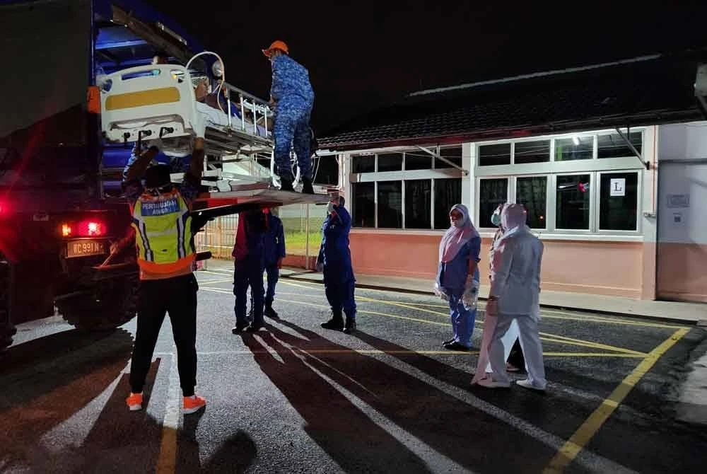 Overweight man transferred from ambulance to truck