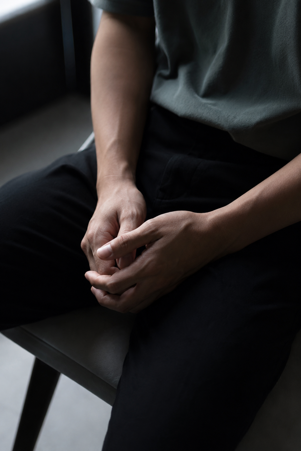 AI image of man's hands in lap