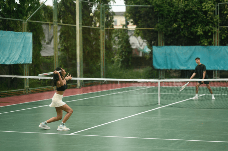 Couple playing tennis