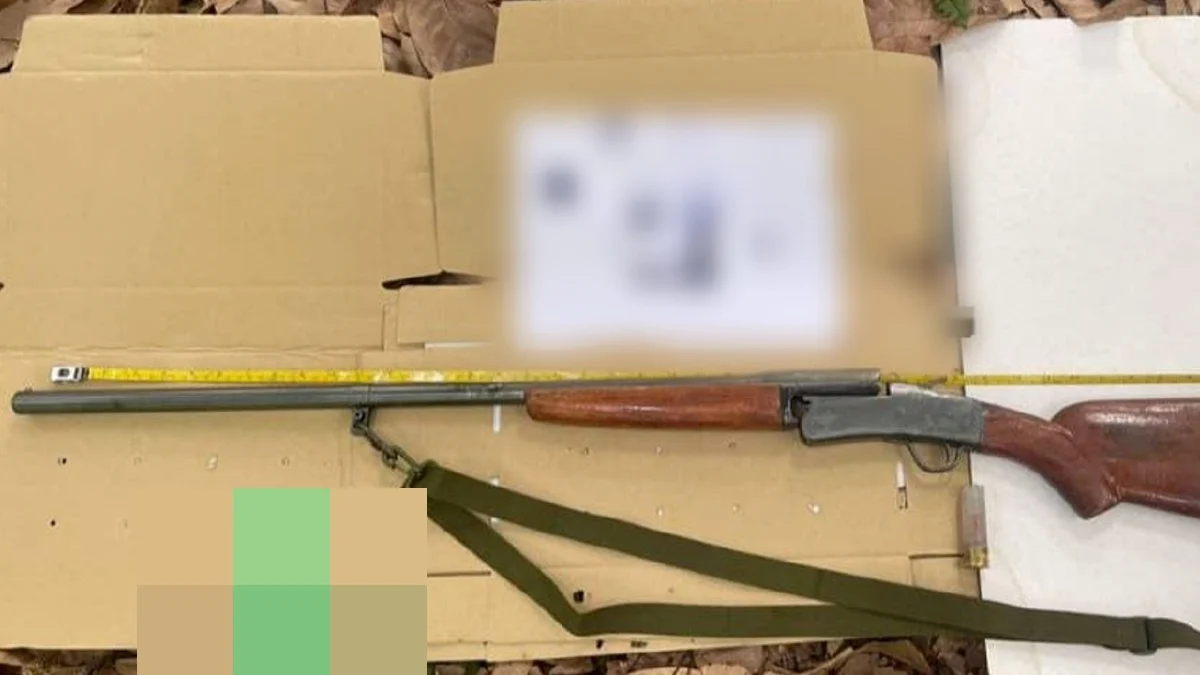 a shotgun displayed on a table