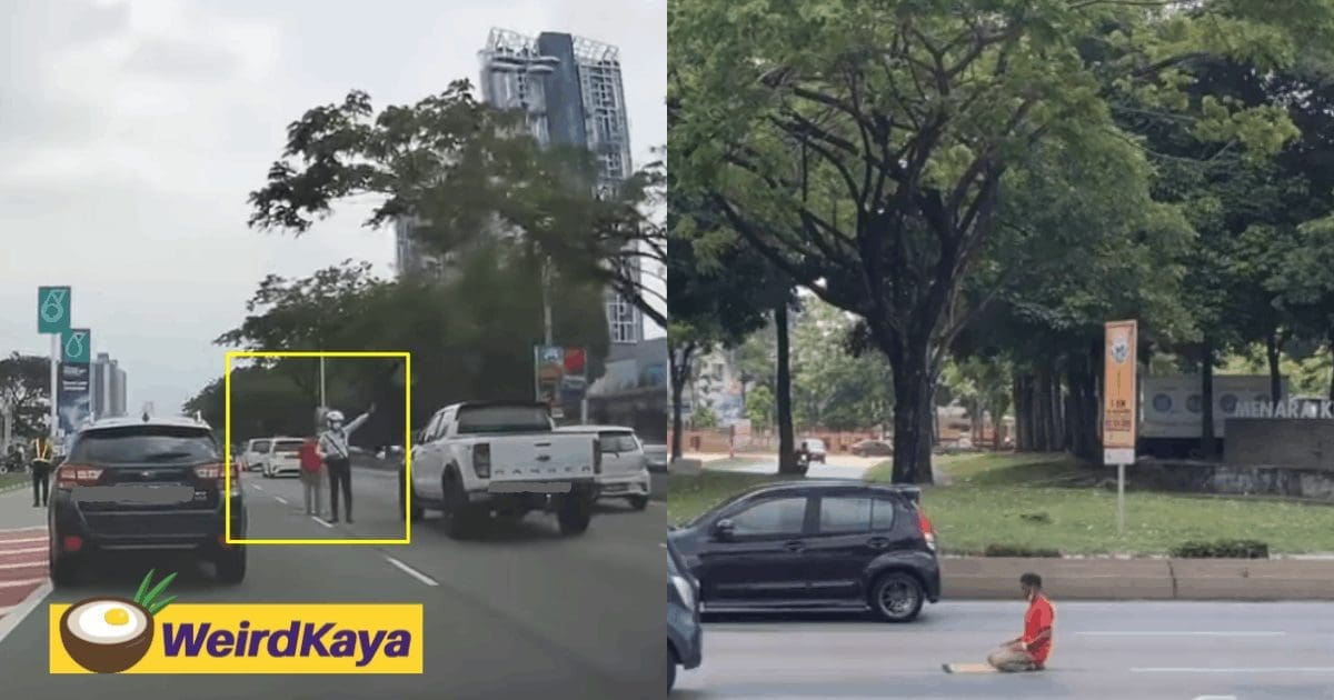 Officer directing traffic while man pray in middle of busy street