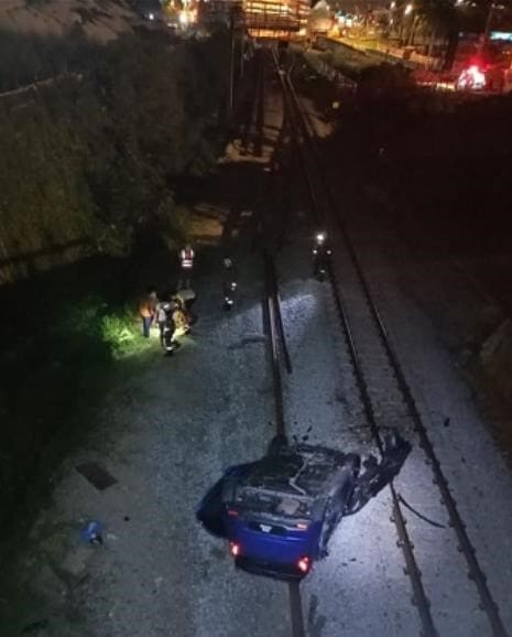 Man Survives Deadly Crash After His Car Skidded And Fell 9 Metres Onto Railway Track | Weirdkaya Man survives deadly crash after his car skidded and fell 9 metres onto railway track