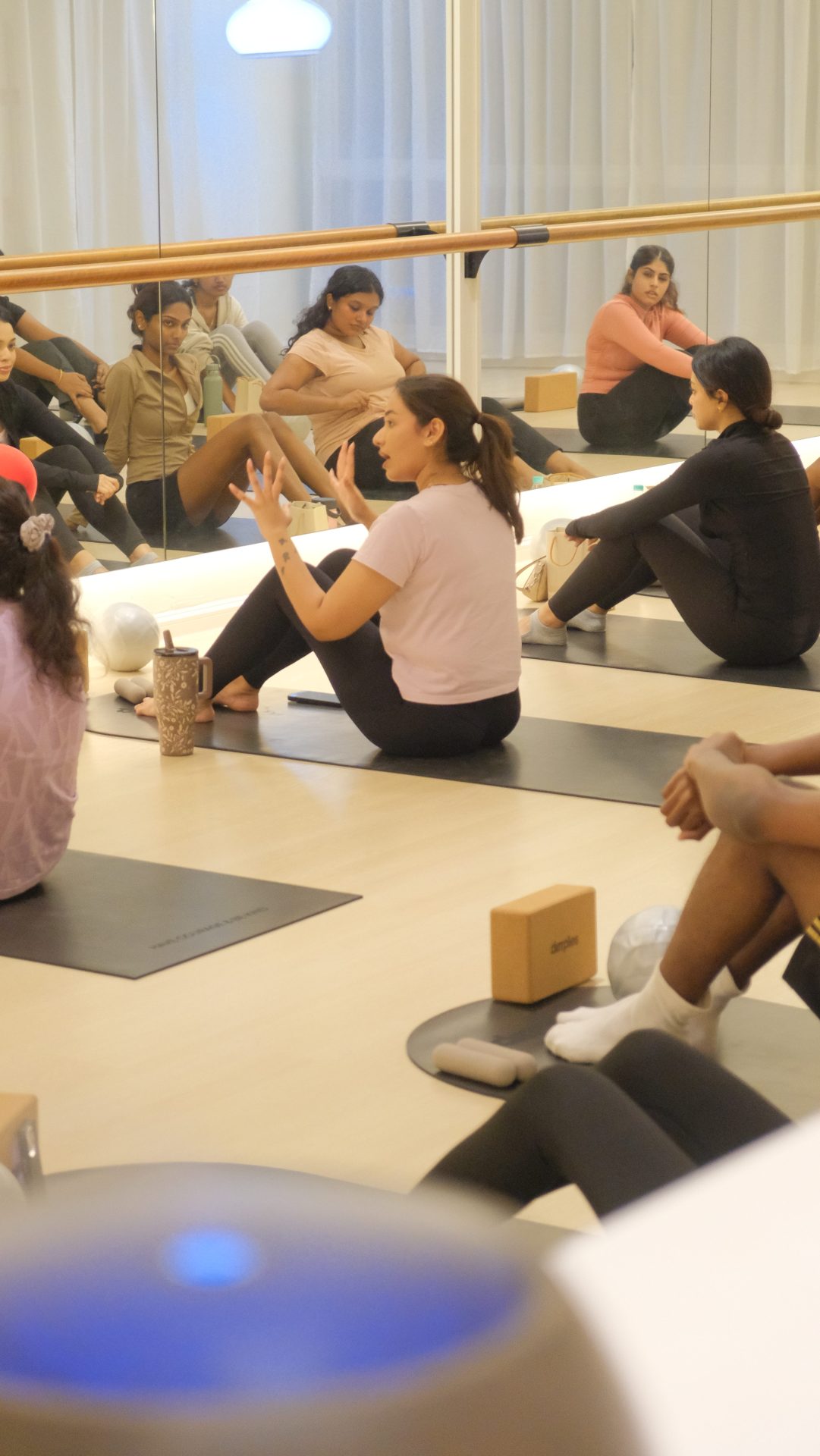Sheshi teaching mat pilates in her studio
