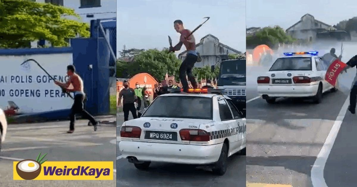 Man runs amok, swinging a parang on top of a police car
