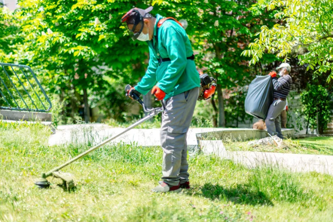 A grass cutter at work