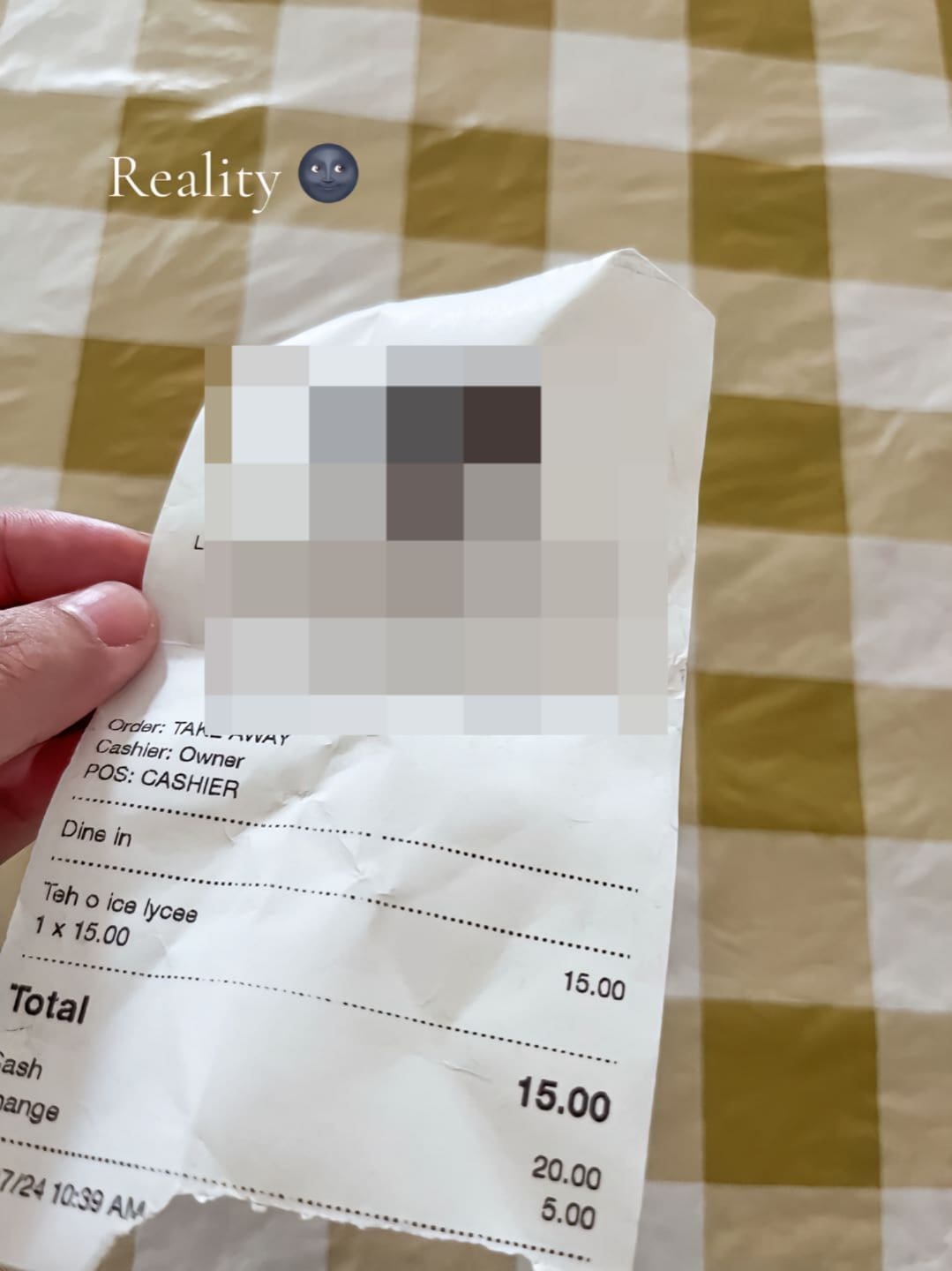 a woman showing a receipt that she have just bought