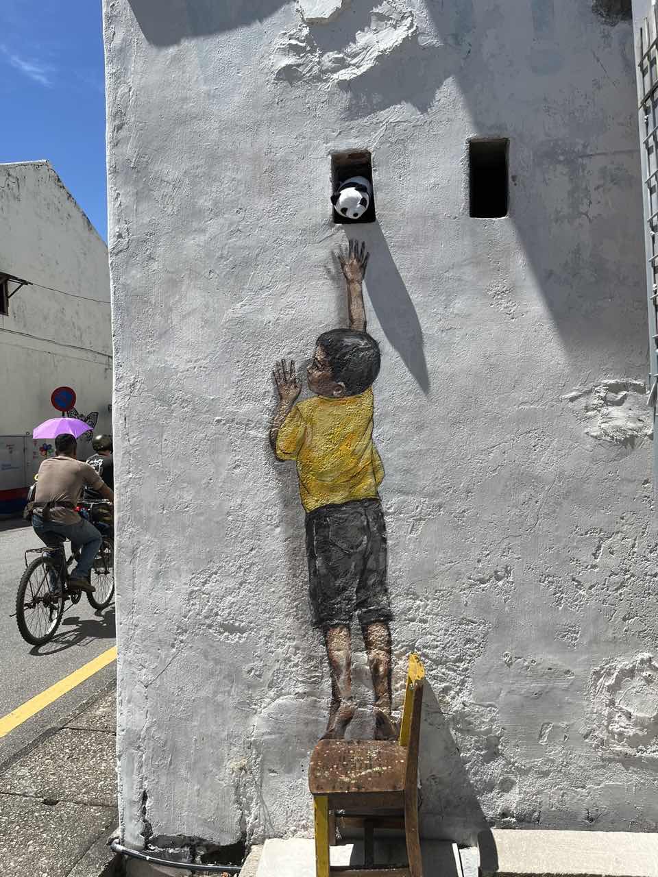 Boy on Chair mural in Penang