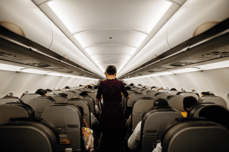 air stewardess inside a plane