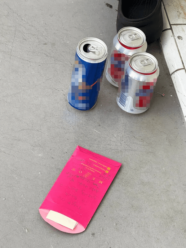Alcohol and red packet left in front of Toa Payoh flat