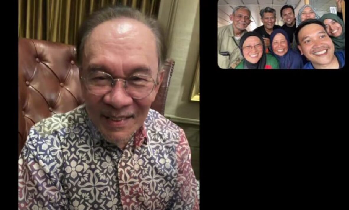 anwar talking on the phone with volunteers