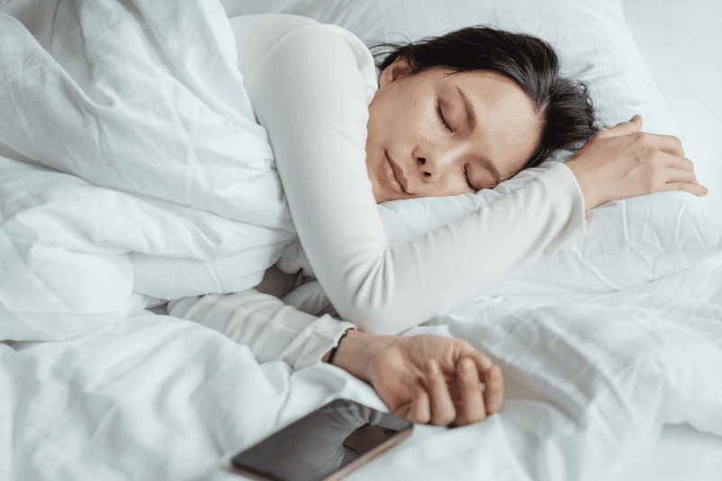 Asian woman in bed