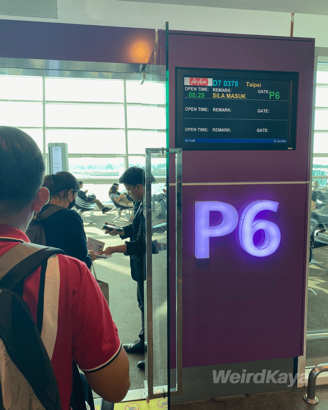 Passengers boarding the plane at KLIA2