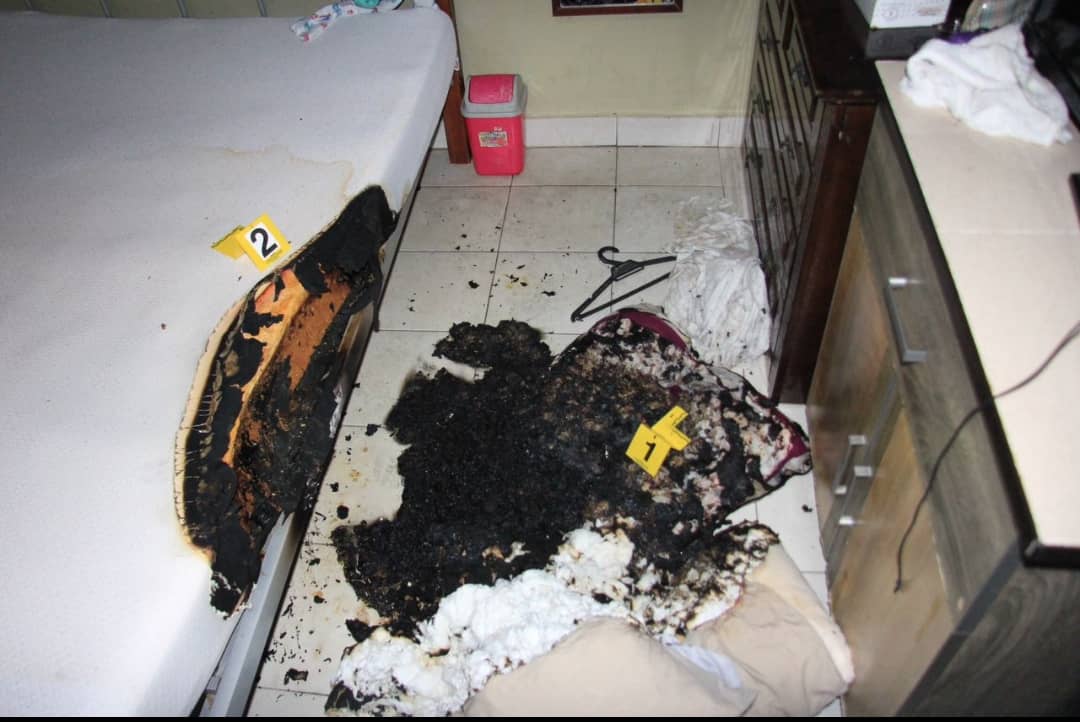 burned mattress and pillow in a room