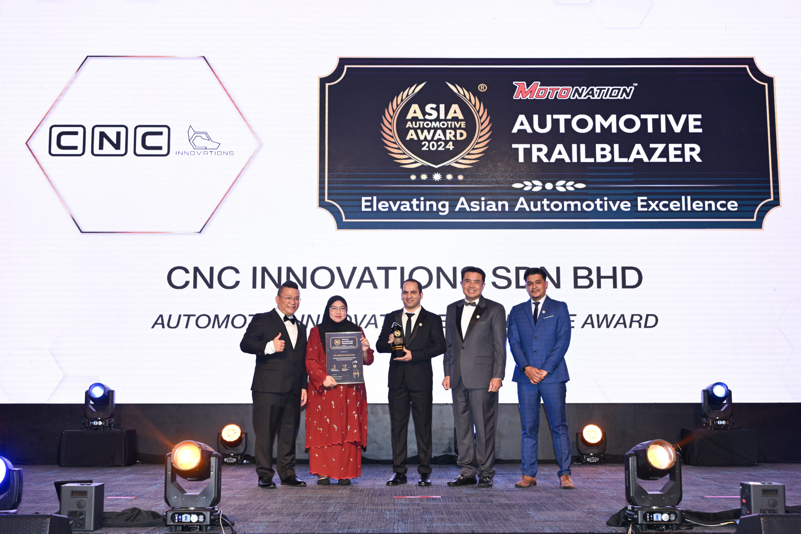 Business Development Manager holding award during the 4th Asia Automotive Award Presentation