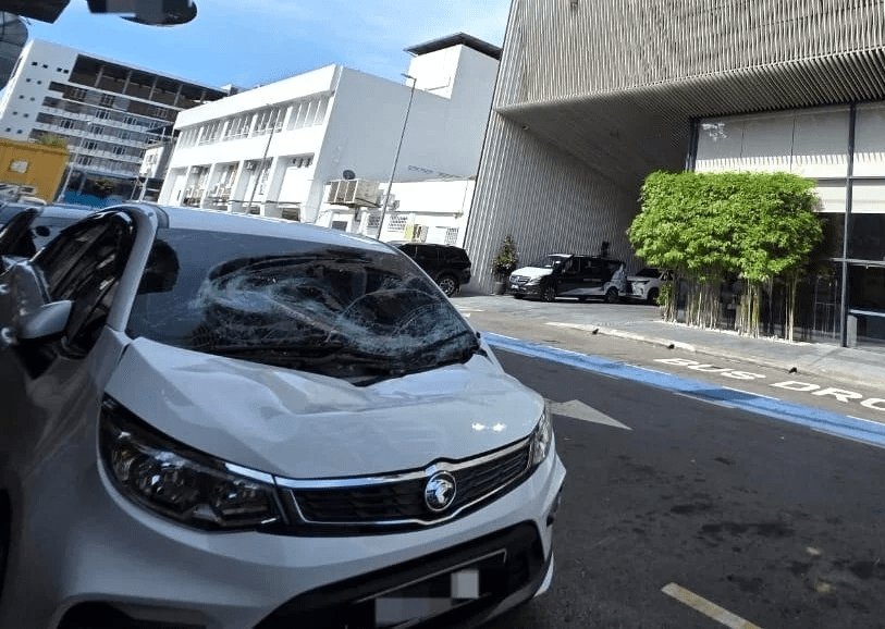 Car damaged after China tourist falls on it in KK