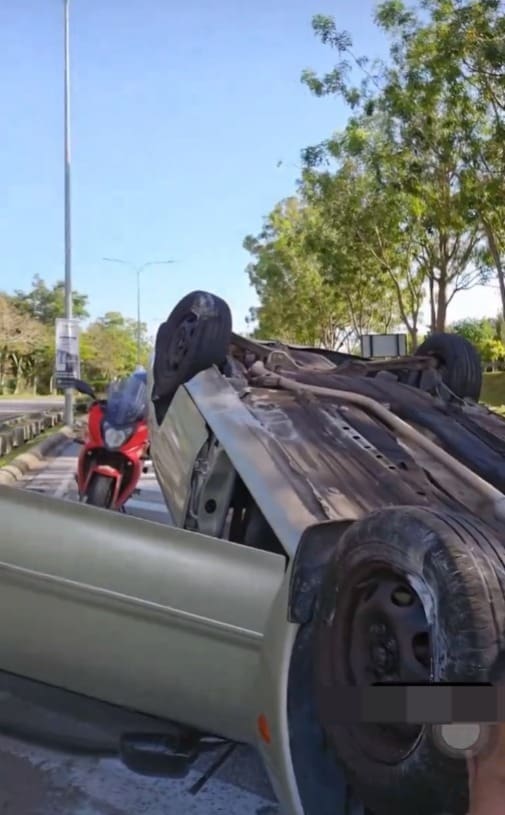 car flipped on a road