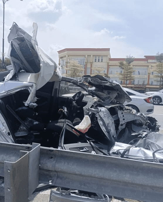 Car totally crushed in road accident in JB