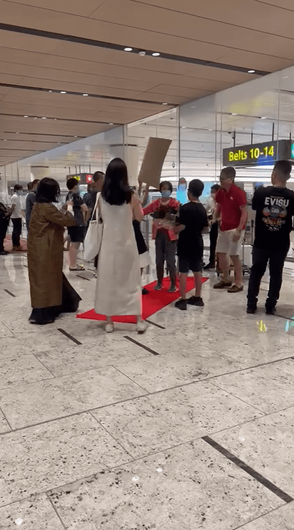 Family welcomes grandma at Changi Airport