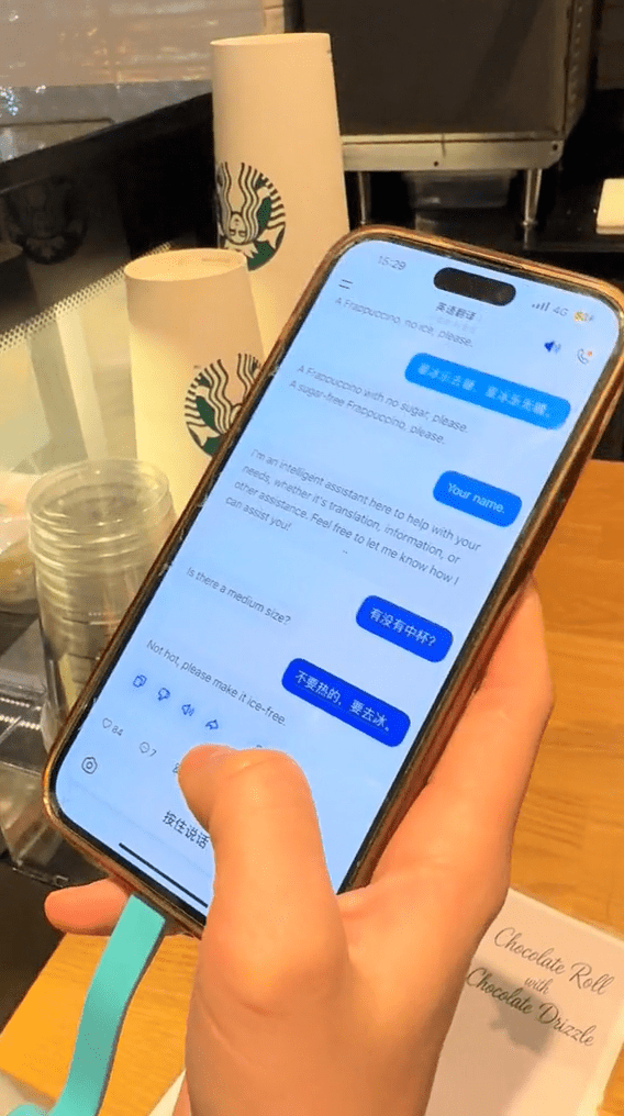 China tourist using AI tool to order coffee in English