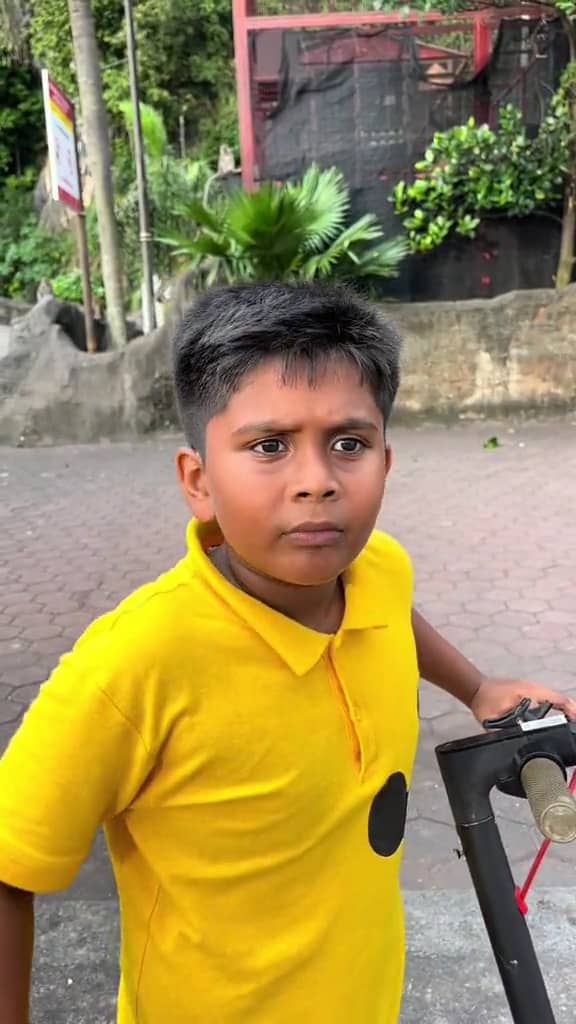 confused msian boy talking a man at batu caves