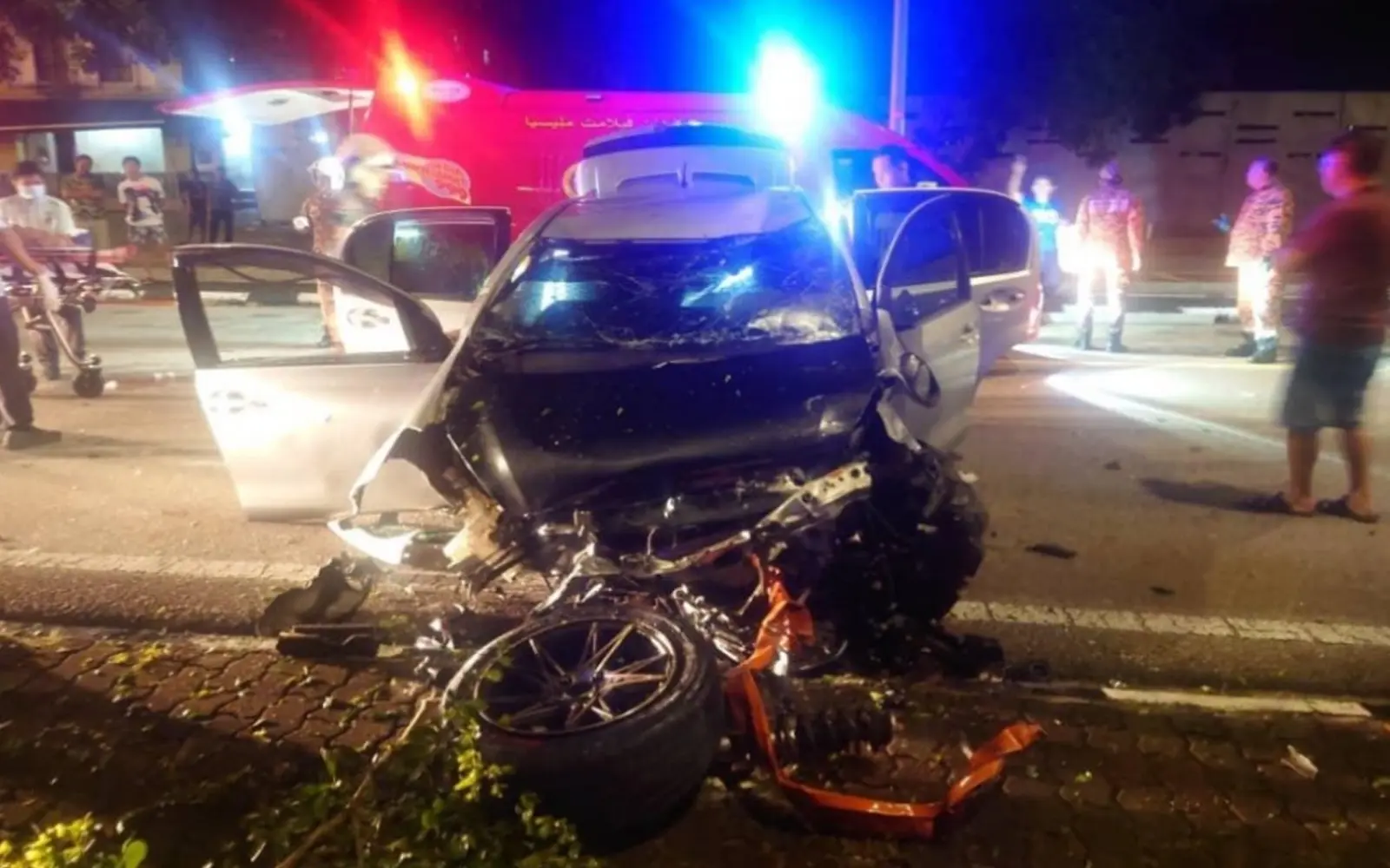 Damaged Myvi that fell off flyover in Melaka