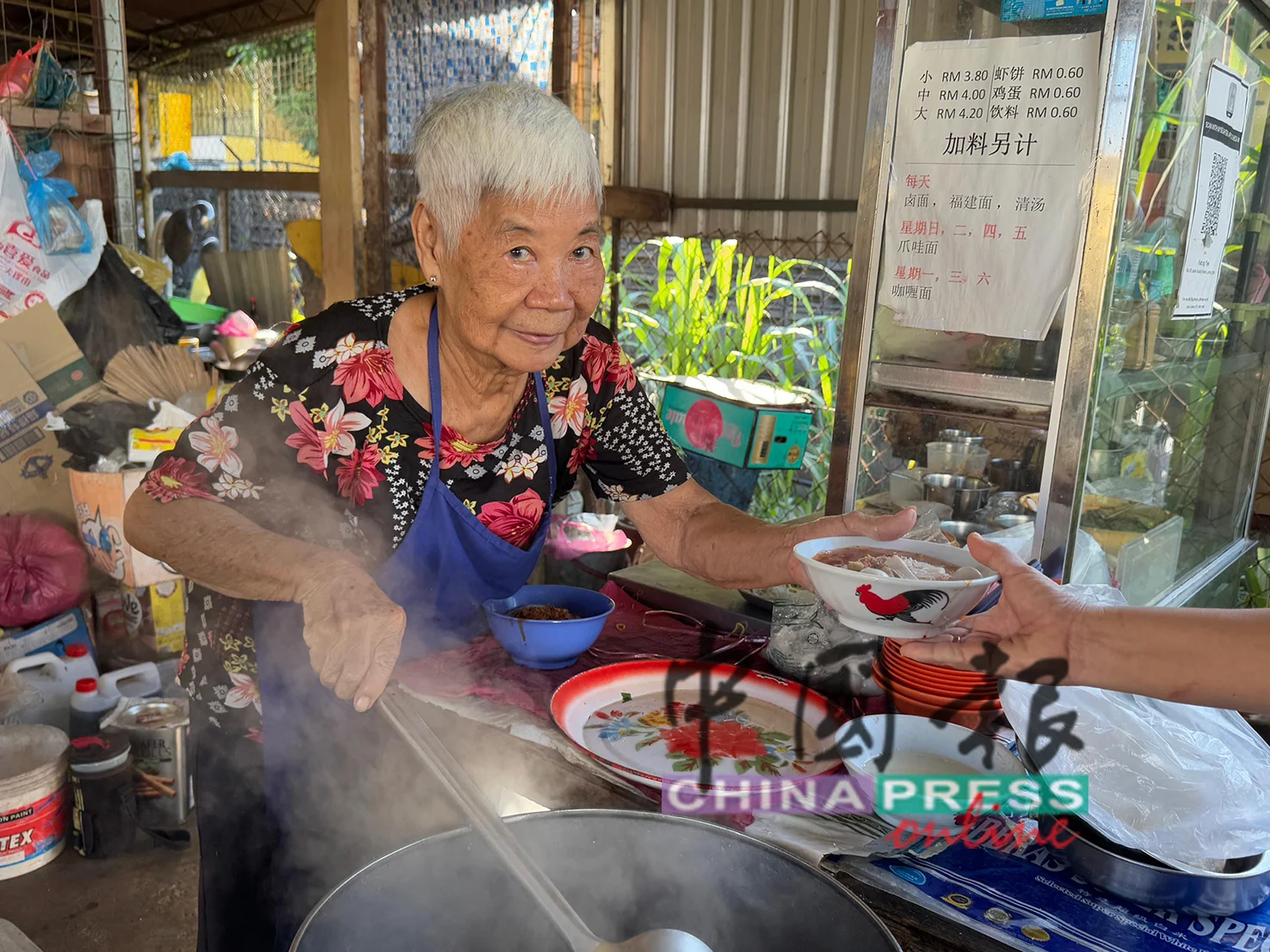 Deng serving noodles at Sungai Petani stall