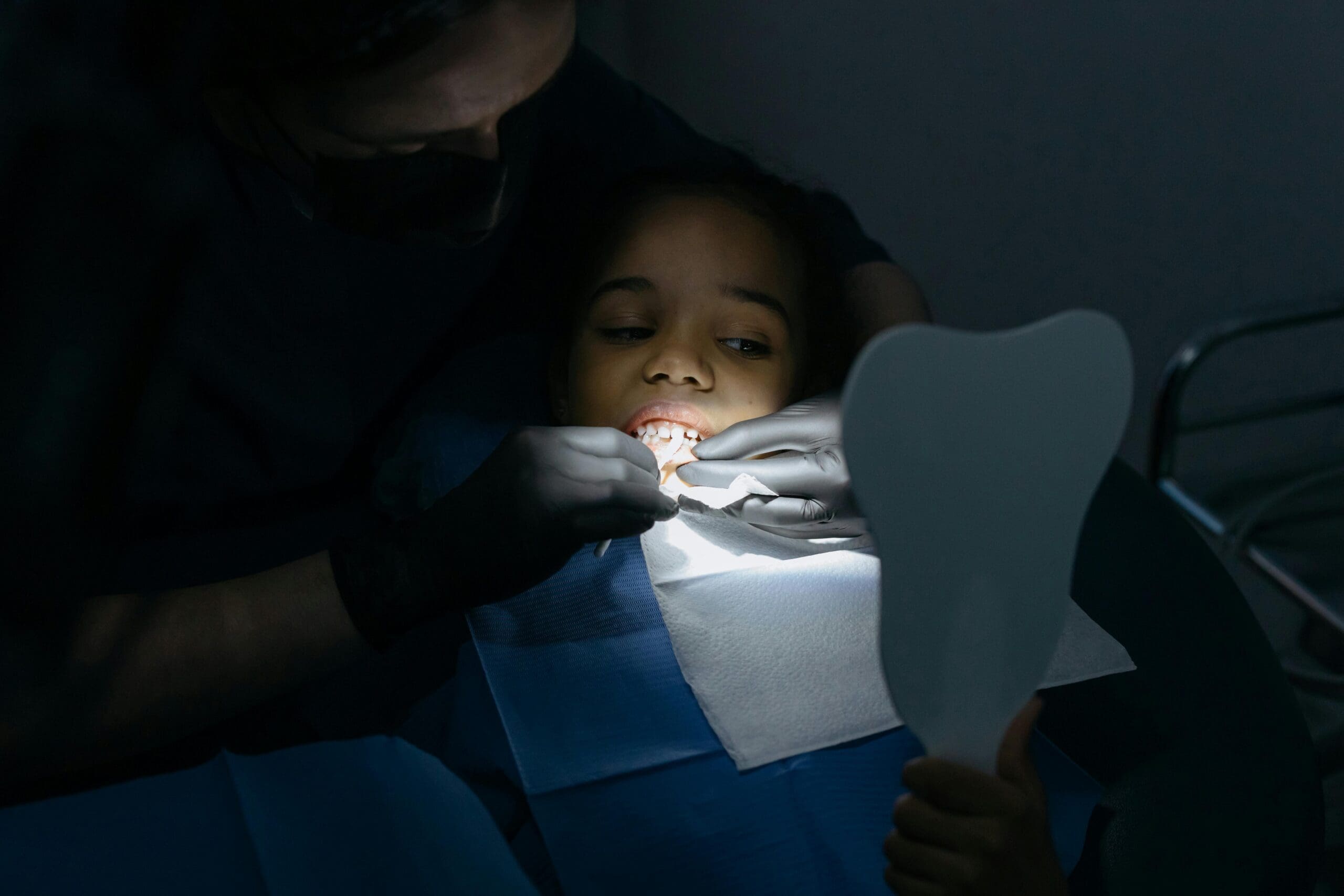 dentist repairing patient's teeth