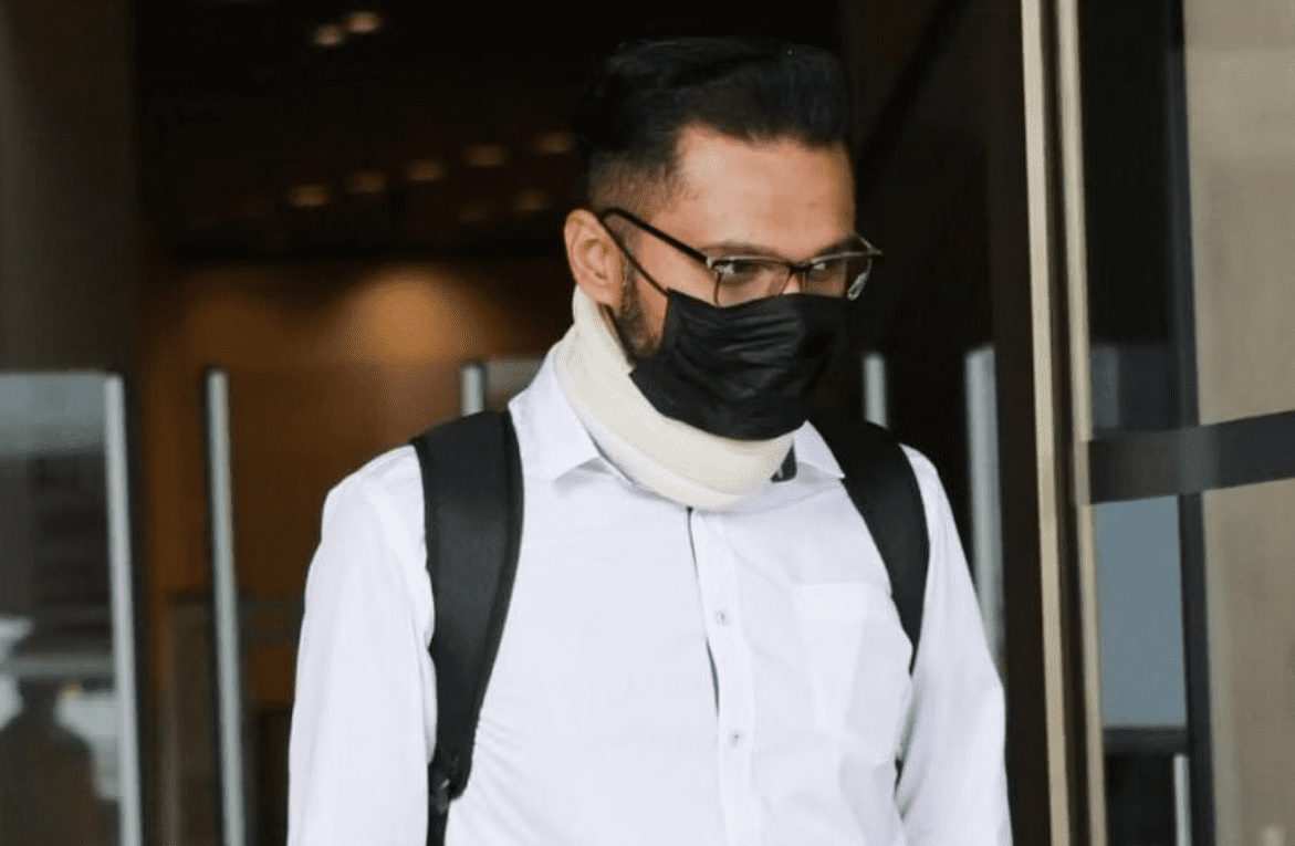 Durairaj Santiran, a former ex-steward of Singapore Airlines coming out from a buliding