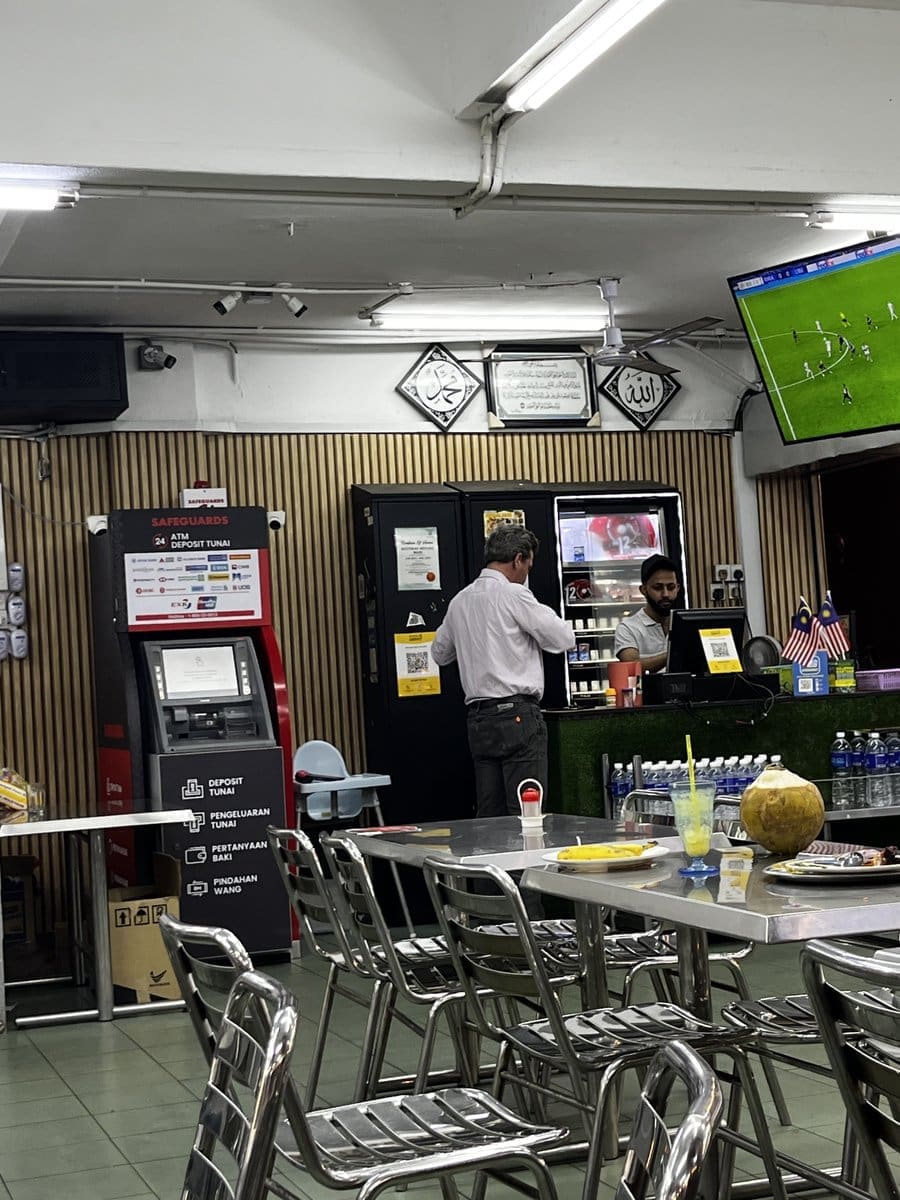 There is an ATM machine at Mamak Restaurant.