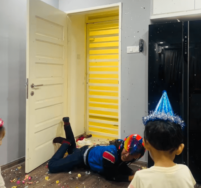 father on the floor after caught off guard