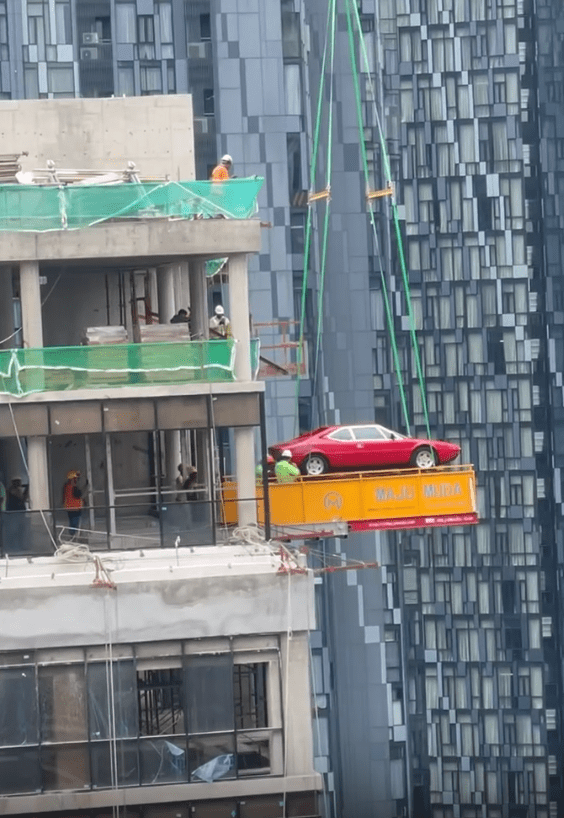 Ferrari lifted into tall building (2)