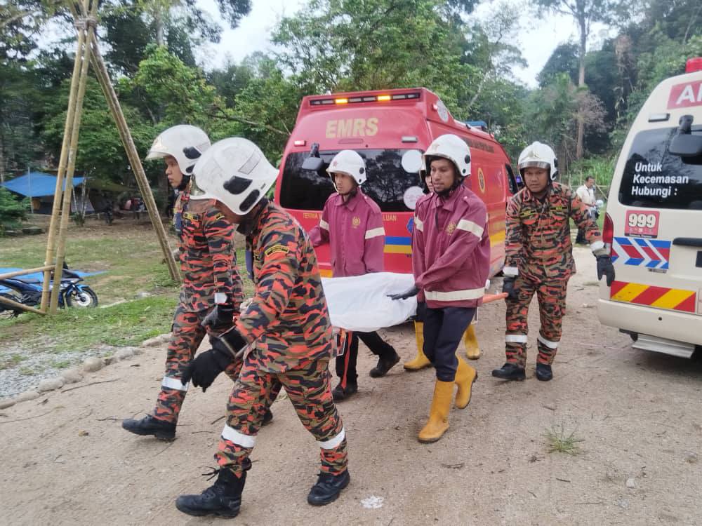 Firefighters carry body of woman who was crushed by tree