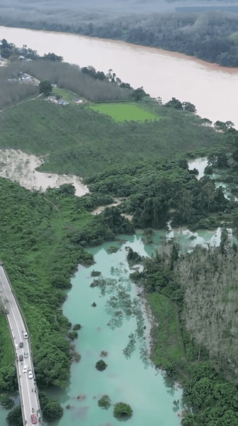 Drone view of Machang's jade green river.