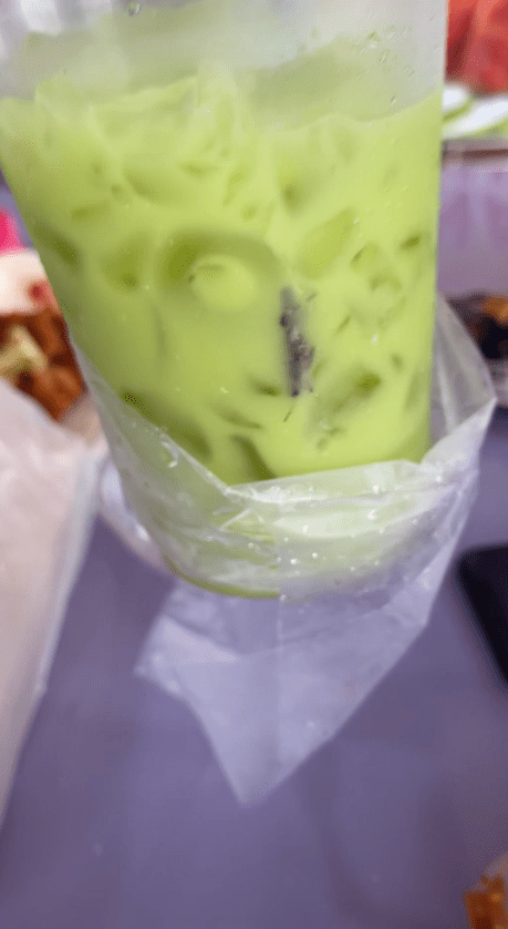 green tea with dead grasshopper