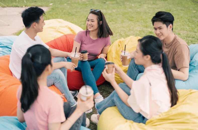 Group of Asians drinking coffee