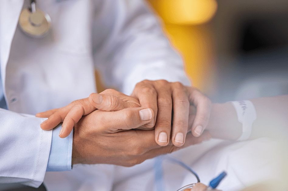 hand holding in hospital