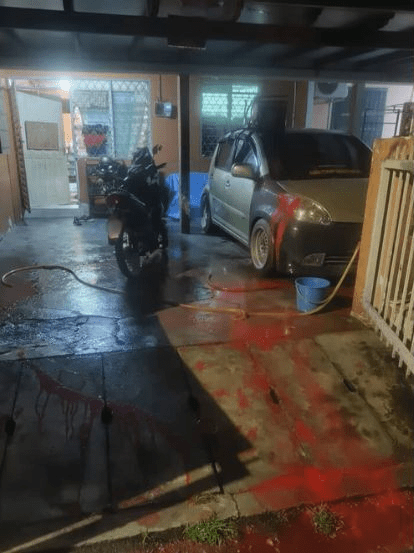 House splashed with red paint