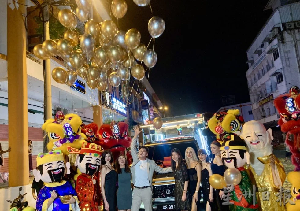 Huang celebrating his birthday with his friends and family with his new car