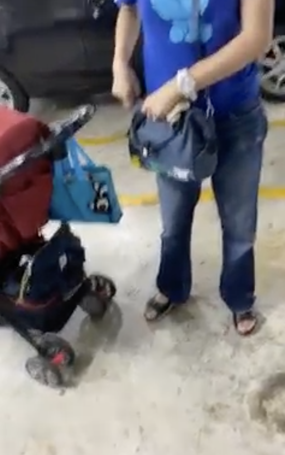 [video] 'parking' her baby stroller in spot while waiting for husband to park their car